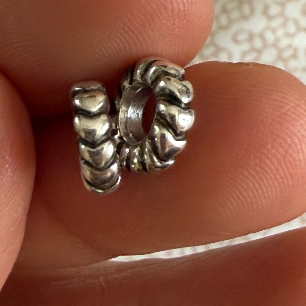 Two Pandora retired heart spacers